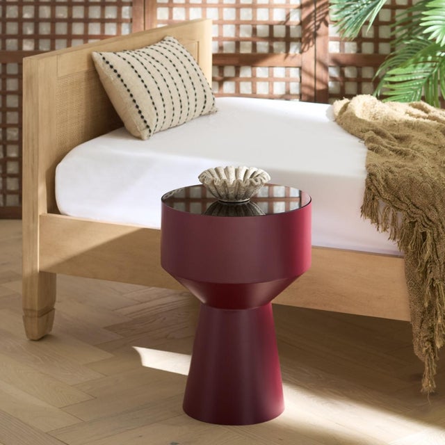 Introduce a touch of opulence and style with the chic Sumiko Accent Table. The versatile Bordeaux and black hues of this...