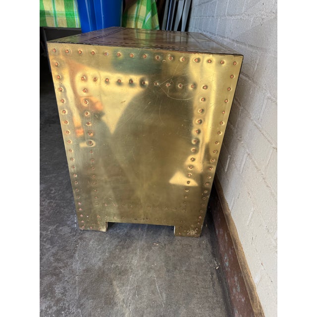 Highly sought after Sarreid Ltd brass clad chest of drawers / nightstand. Wood structure covered with brass sheets and...