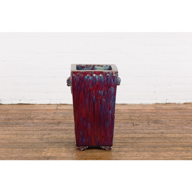 A vintage Chinese ceramic garden planter from the mid 20th century with multi-color glaze, tapering lines and mythical...