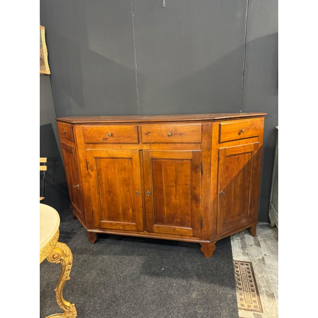 Italian walnut credenza with canted sides. Lined with Florentine paper. Clean inside. Dated 1860. From Vicenza, Italy....