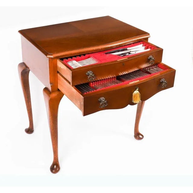 An elegant Vintage English silverplated floor standing twelve place setting 110 piece canteen of cutlery by Thomas Ward &...