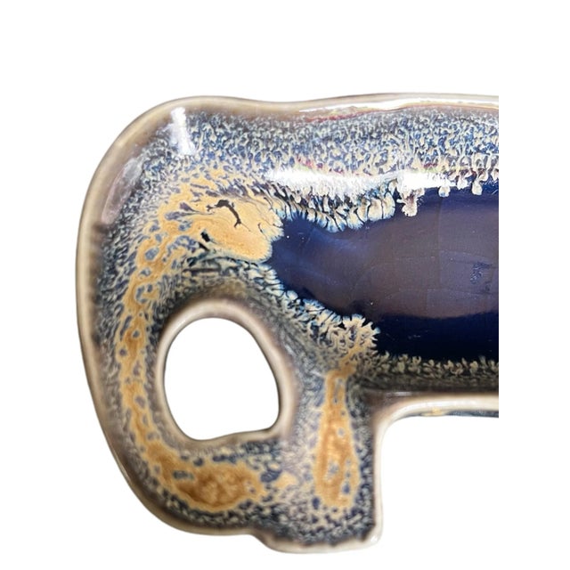 Small vintage ceramic ashtray depicting an elephant. Perfect catchall.