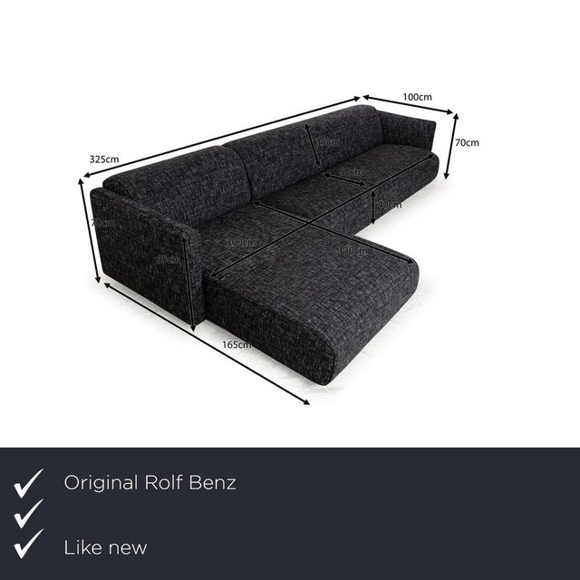 The 6300 sofa by Rolf Benz has been reupholstered in a black and white fabric and stands on narrow, angular metal feet. It...