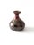 This vintage handmade studio pottery vase features a bulbous base and a narrow bottleneck, creating an elegant silhouette....