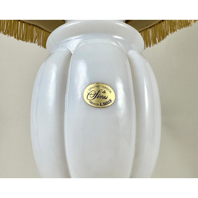 Adorn your living space with the timeless charm of this exquisite vintage table lamp by L.Seiler, a distinguished name in...