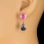 Introducing our Lovely Dangle Earrings, featuring stunning oval pink sapphires weighing 6.64 carats, elegantly paired with...