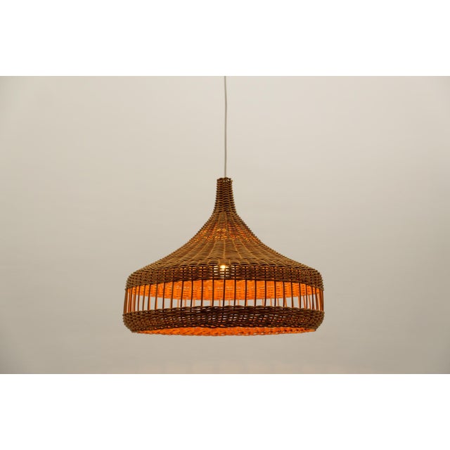 Rare and lovely decorative Mid-Century Modern pendant lamp. Designed and manufactured probably in Italy, 1960s. The lamp...