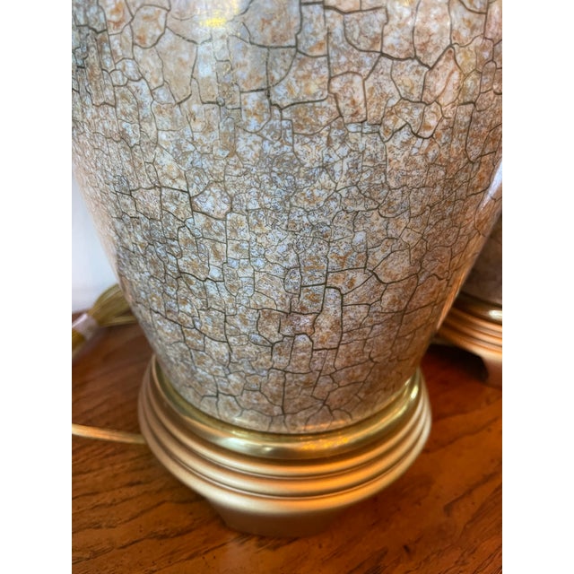 Elegant pair of vintage table lamps by Frederick Cooper, featuring softly rounded ceramic bodies with a refined crackle-...
