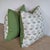 Colefax & Fowler Ashmead print pillows in leaf on a creamy white background. Back is coordinating green linen. Invisible...