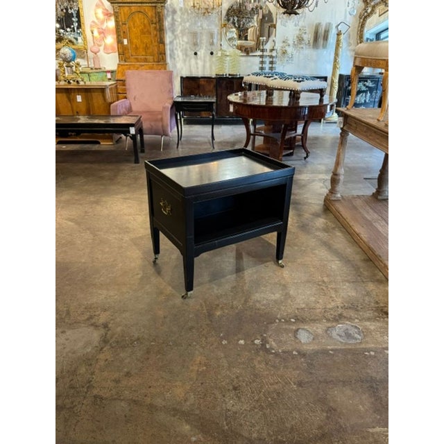 The Vintage Black Lacquer Side Table is a stylish and durable piece of furniture . This original piece features a sleek...