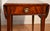 We are pleased to offer this beautiful pair of Regency Pembroke drop-leaf side tables, by Weiman Furniture from the 1930s....