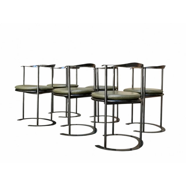 Catilina chair with painted steel frame, plywood seat top and polyurethane cushions upholstered and covered in green...