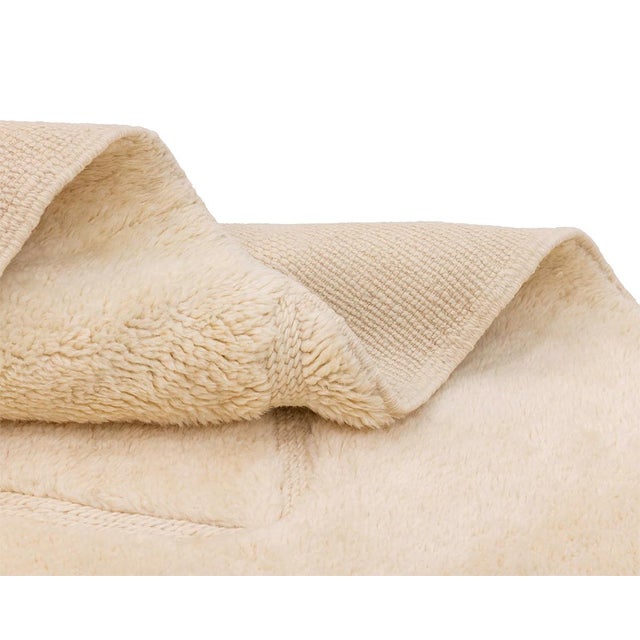 Pure, luminous, and quietly detailed: a canvas of ivory that reveals itself slowly. A soft ivory field stretches across...