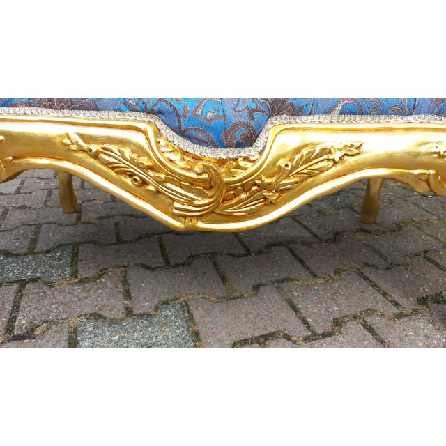 Bring refined Parisian elegance into your home with this 1970s French Louis XVI–style settee, crafted in solid gilded...