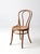 This antique bentwood café chair features an arched bentwood back, softly curved legs, and a warm wood tone that brings...