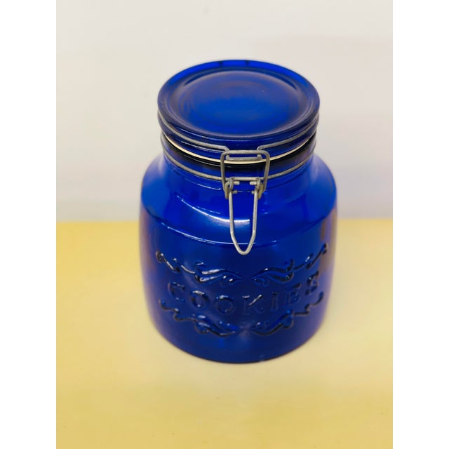 Stunning Vintage 1979 Italian Cobalt Blue Glass Cookie Jar with Wire Latch Lid. 2 Quarts. Measures 7.25” tall x 5.75” in...