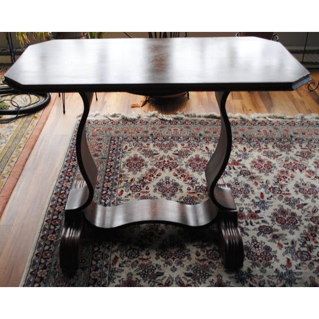 This Antique Mahogany Library table, is smaller in design that most. It fits nicely into a large variety of spaces. Its...