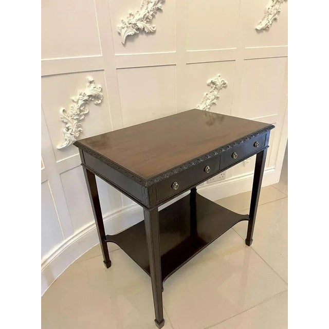 Quality edwardian mahogany free standing side/lamp table having a glorious mahogany top with a quality carved edge, two...