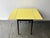 This is a compact Mid-Century vintage dining / kitchen table featuring a rectangular top with rounded corners. The...