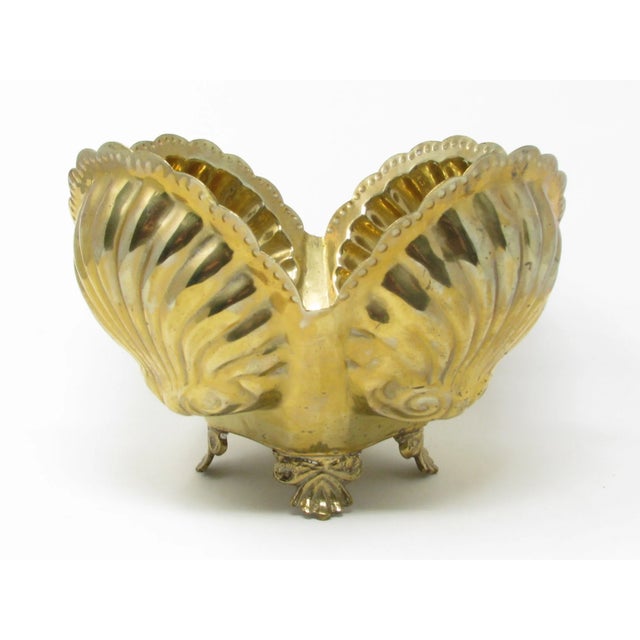 Vintage footed open clamshell shaped brass planter.