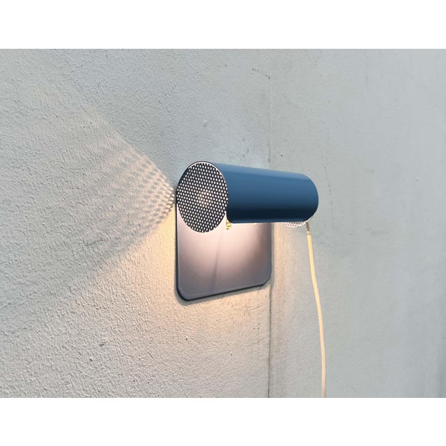 Wall lamp by the Danish manufacturer Abo Randers from the 1980s. The lamp body consists of a sheet of metal bent in a...