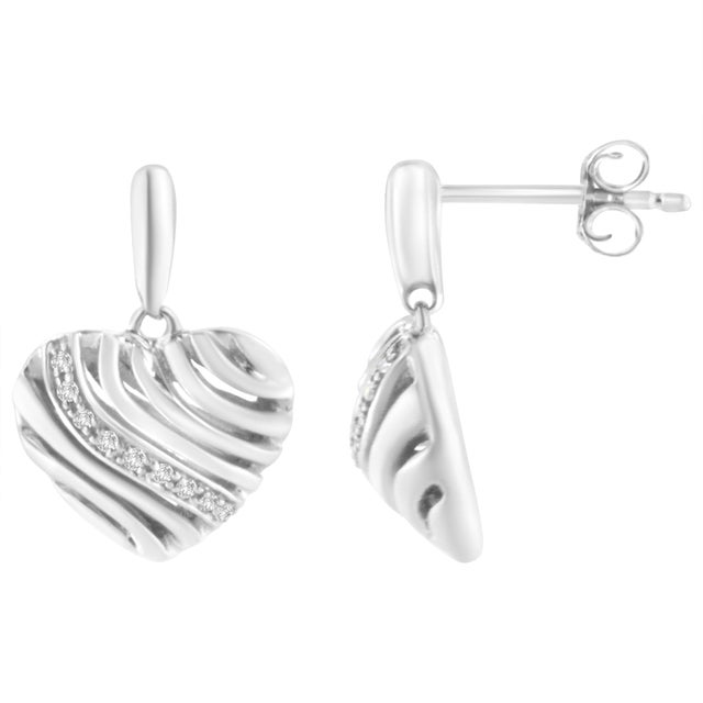 Steal her heart with these chic diamond puff earrings. Fashioned in glowing sterling silver these heart shape puff...