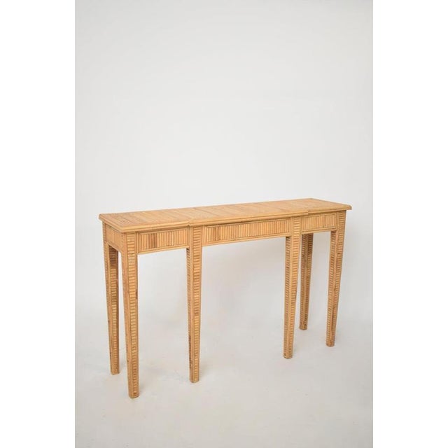 "Villandry" rattan console table, Barracuda Edition. "Villandry" rattan table console resting on six feet and ornamented...