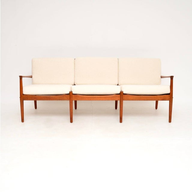 A beautiful and extremely well made Danish teak vintage sofa by Svend Age Eriksen. This was made in Denmark by Glostrup,...