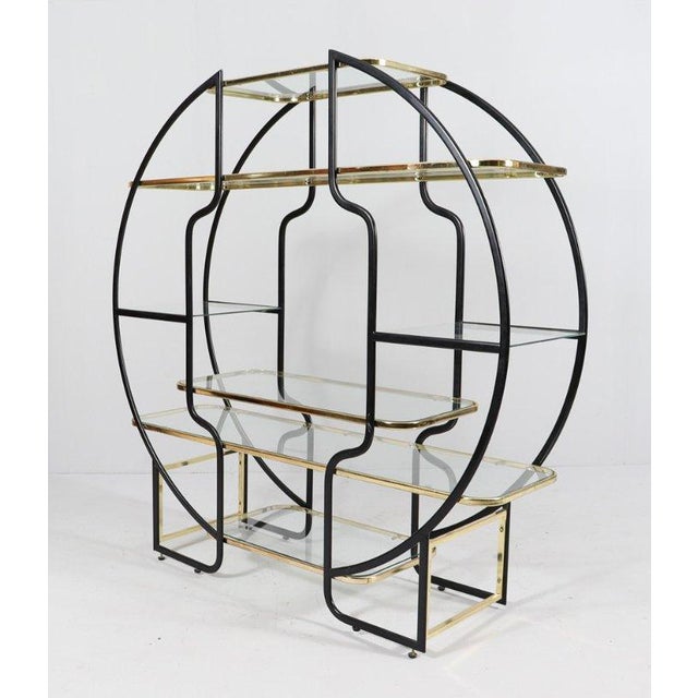 Hollywood Regency Luxury Etagere Shelf. Beautiful Maison Jansen, Milo Baughman style round étagère or vitrine with seven...