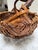 Vintage rustic Asian style wood woven basket with arched natural tree branch handle. Perfect for decor or rolled hand...