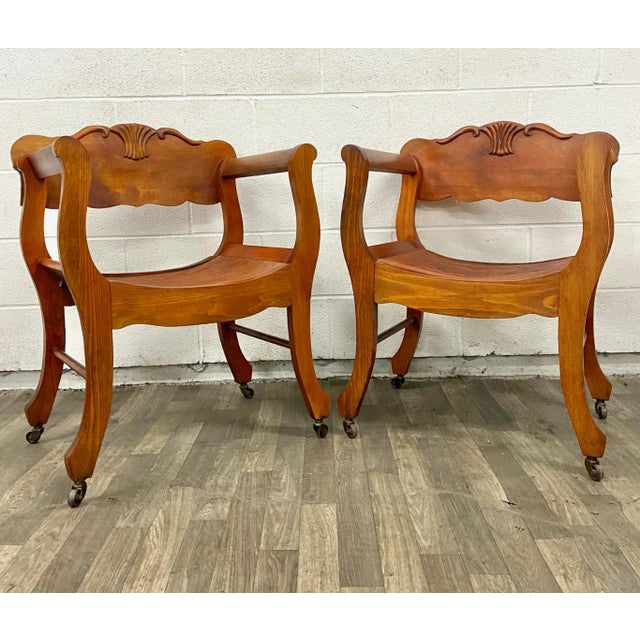 This is a gorgeous pair of antique Victorian Renaissance Revival style tiger oak carved saddle or sling Curule open...