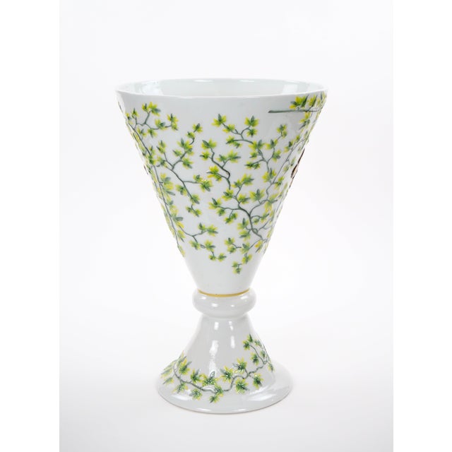 An impressive and unusually tall hand-painted porcelain decorative vase, made in France during the mid to late 20th...