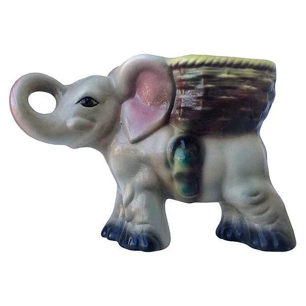 A 1950's Japanese large ceramic elephant plant holder, with whicker woven basket, with belted design, and hand painted...