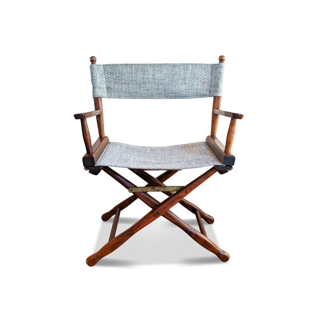 A walnut frame mid-century directors chair from the Gold Medal Furniture Company. The folding chair has been restored with...