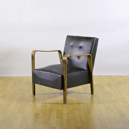 This imposing armchair, produced by the renowned anonima castelli of bologna, represents an excellent example of 1940s...