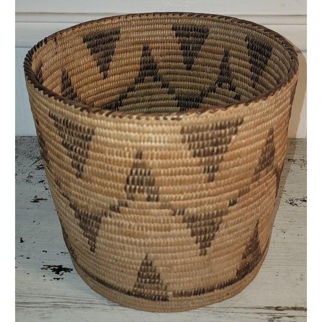 This hand woven geometric coiled Navajo Indian Pima basket is in fine condition.It has a geometric pattern.The condition...