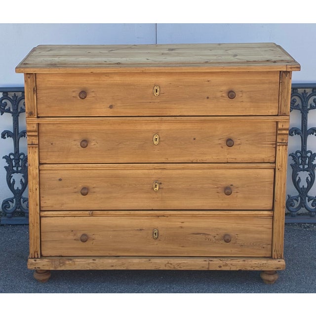 This large chest of drawers has considerable presence and character. The top has a chamfered edge before stepping down to...