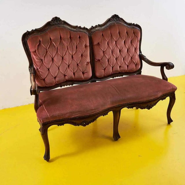 Vintage Sofa in Carved Wood and Velvet, in Good conditions. This piece is attributed to the mentioned designer/maker. It...
