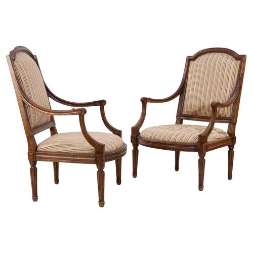 Beautiful pair of walnut Louis XVI chairs realized in Italy in the late 18th Century. Reupholstered in the mid-20th...