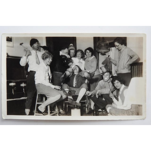 Early 20th century party time snapshot photograph of a group of friends goofing off. Unframed, corner bumps.