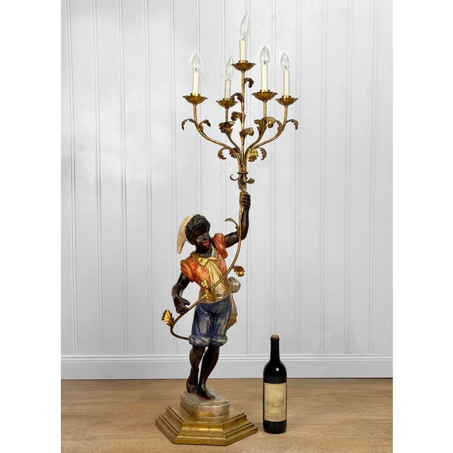 An Original 1970's Italian Nubian Boy Figural Candelabra Monumental Sized - Stands 52" tall Painted Wood Boy Shown Holding...