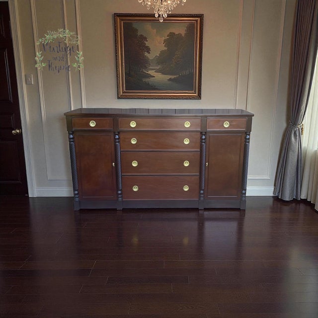 This Neoclassic Mahogany Buffet by Grand Rapids Chair Company has been sanded stained and sealed with polyurethane. The...