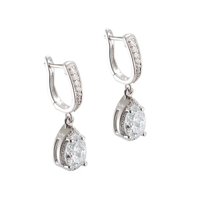 Gender: Ladies Metal Type: 14K White Gold Length: 1.00 inches Width: 7.00 mm Weight: 3.66 grams One pair of ladies rhodium...