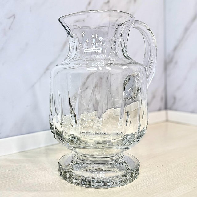 Late‑20th‑century German crystal from Villeroy & Boch, the “Arabelle” pitcher features deep vertical cuts, a flared spout,...