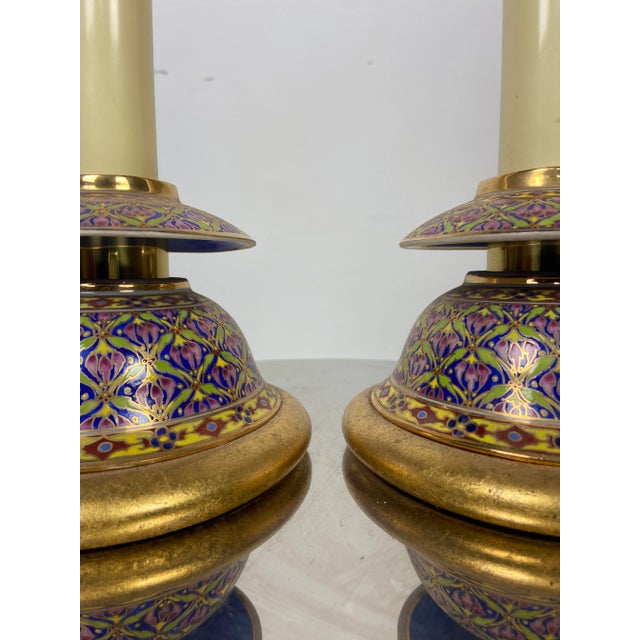 Lovely pair of cloisonne side table lamps. Patterning is navy and gold. Beautiful condition. One is in perfect working...