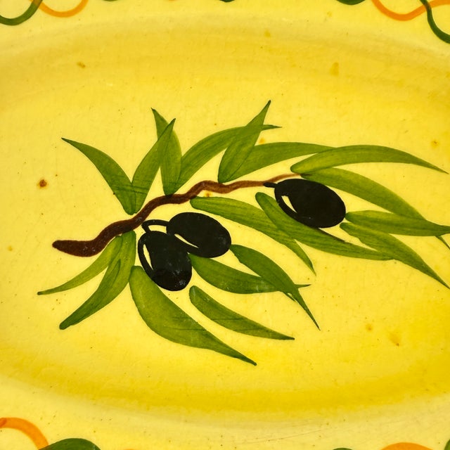 From France, a piece of hand made terra cotta pottery, an oval olive server, circa 1950 – 1960. Rustic in form, charmingly...