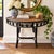 A beautifully sculptural vintage demilune console crafted in dark-finished rattan with a richly textured natural woven...