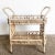 Indulge in the whimsical design of this Boho Chic Woven Ribbon Rattan Two-Tier Bar Cart. A true statement piece, the cart...