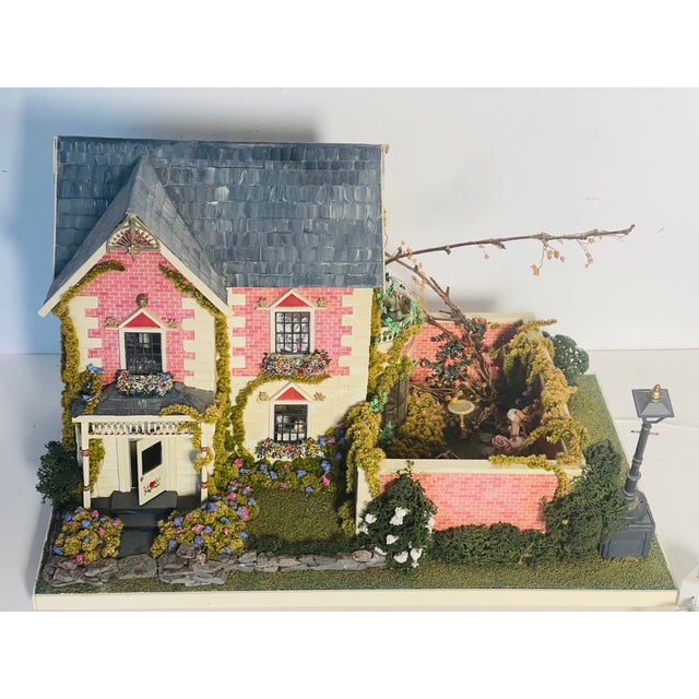Vintage miniature dollhouse with garden installation by Florida miniaturist artist Helen Valerio. Unique collectible piece.