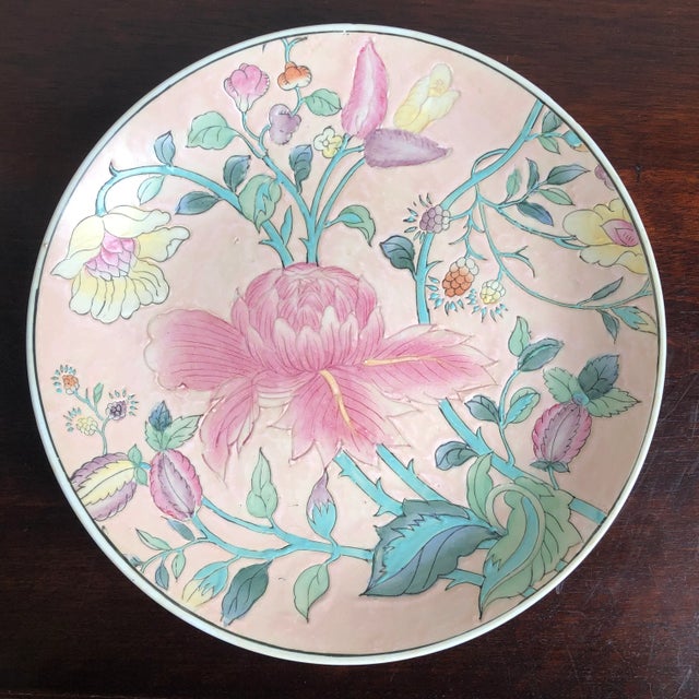 A beautiful decorative porcelain plate hand-painted in Macau, China. Perfect for table or wall display. Marked on bottom.
